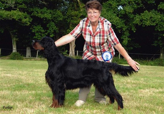 Woman posing black and tan dog